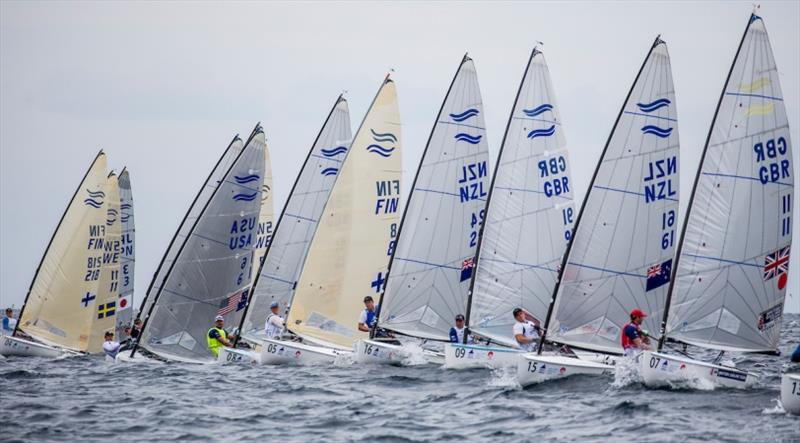 Finn fleet on Day 3 at World Cup Series Enoshima photo copyright Jesus Renedo / Sailing Energy / World Sailing taken at  and featuring the Finn class