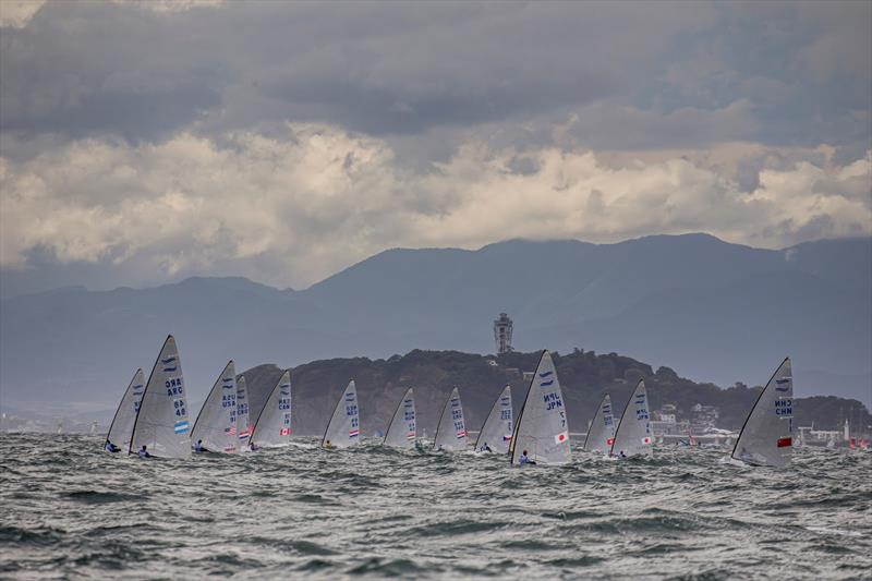 Finn class athletes compete near the island of Enoshima, the venue for the sailing events of the Tokyo 2020 Olympic Games (July 23 to August 8, 2021) photo copyright Jesus Renedo / Sailing Energy taken at  and featuring the Finn class