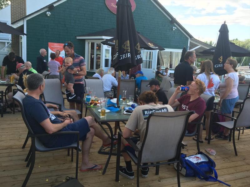 Post-race refreshment on day 2 of the Fireball North American Championships photo copyright Derian Scott taken at Pointe Claire Yacht Club and featuring the Fireball class
