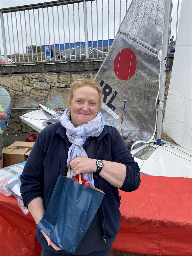 Helly Hansen Irish Fireball Championships - Race Officer Suzanne McGarry with her present from the Irish Fireball Class Association photo copyright Frank Miller taken at Dun Laoghaire Motor Yacht Club and featuring the Fireball class