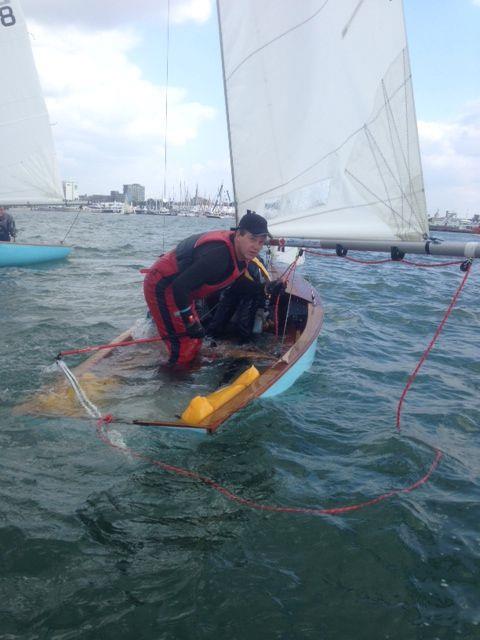 Stuart Hudson gets that sinking feeling during the Battle of the Classes at the PSP Southampton Boat Show photo copyright Peter Barton taken at  and featuring the Firefly class