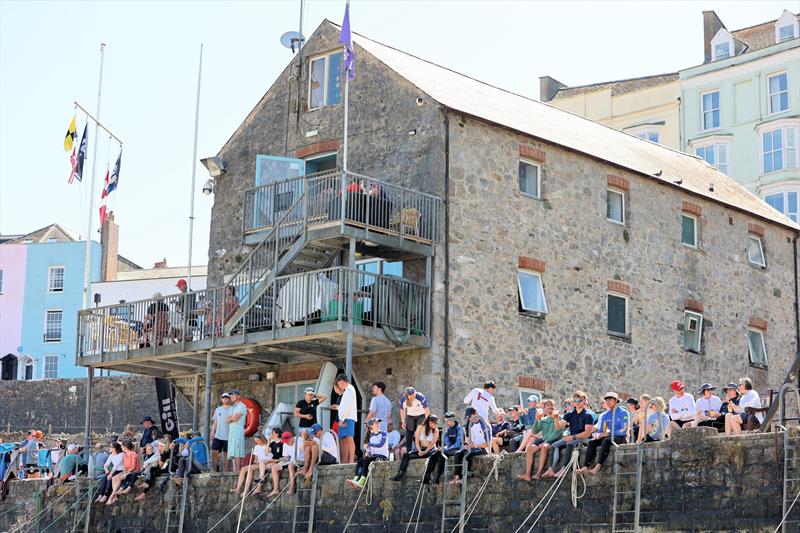Sailors gather in the sunshine at the clubhouse on Day 4 of the 80th Anniversary Firefly Nationals at Tenby - photo © Mark Jardine