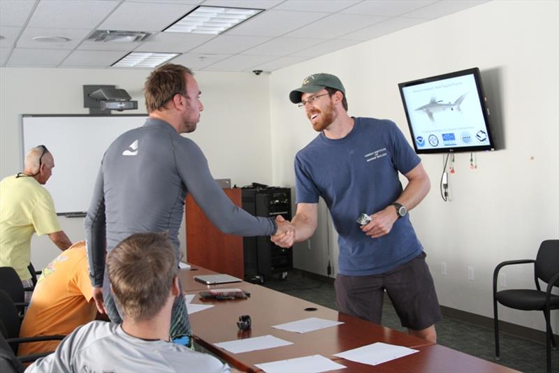 Mark Royer meets with a fisherman at the beginning of the shark tagging workshop in Kona photo copyright NOAA Fisheries / Ali Bayless taken at  and featuring the Fishing boat class