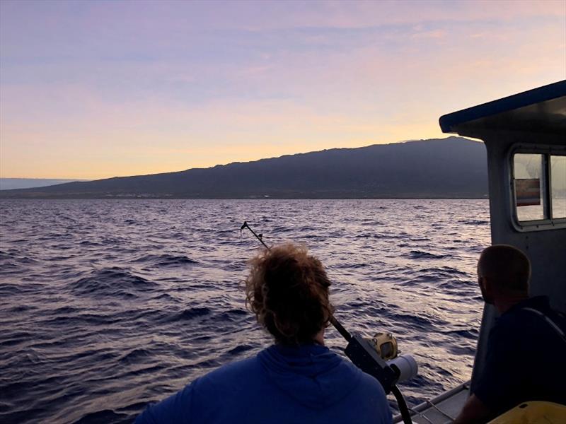 Melanie Hutchinson and fisherman Rick Reger watch the sun come up after a long night of fishing photo copyright Ali Bayless taken at  and featuring the Fishing boat class