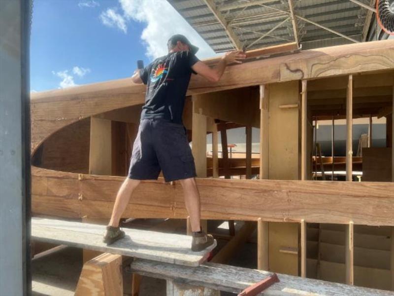 Hull #8 Brian shaping deck house radiuses - photo © Michael Rybovich & Sons