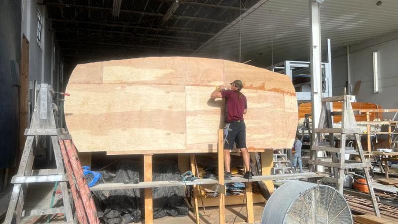 Hull #9 Scott grinding transom - photo © Michael Rybovich & Sons