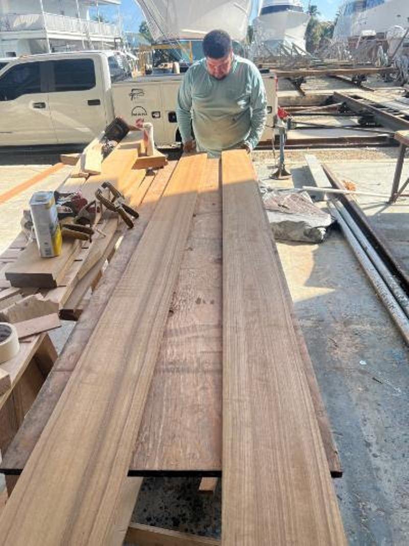 Hull #7 - Eric selecting margin boards - photo © Michael Rybovich & Sons