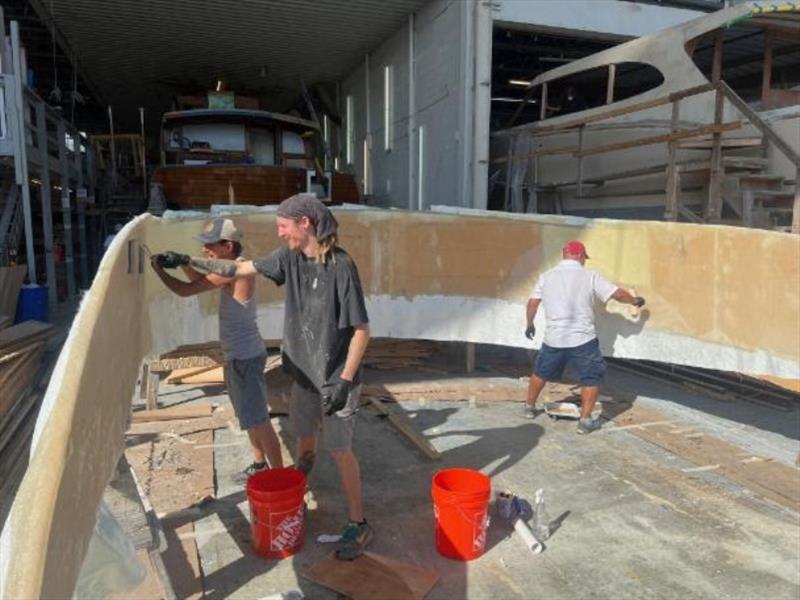 Hull #8 - Flipper, Daniel and Marcos glassing inside of bridge - photo © Michael Rybovich & Sons