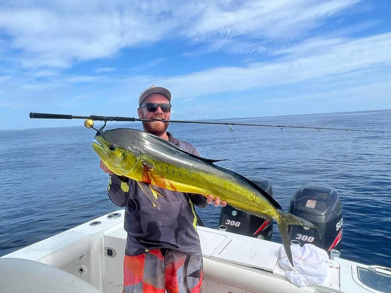 Andrew with a lit up mahi mahi, aka dolphin fish photo copyright Fisho's Tackle World taken at  and featuring the Fishing boat class