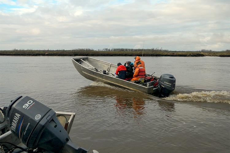 Boat heading out to conduct research - photo © Darcie Neff