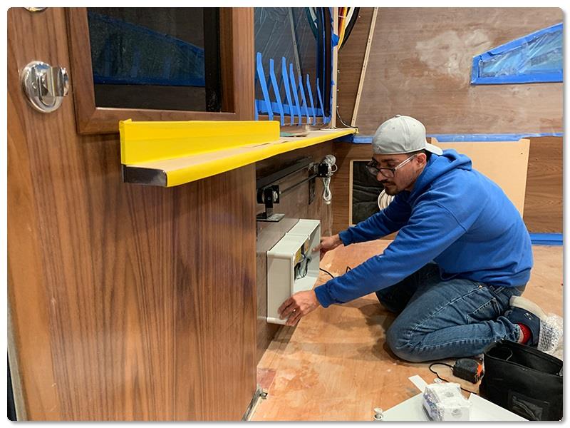 Finish Electrician Carlos Hernandez installs the automatic control box - photo © Viking Yachts