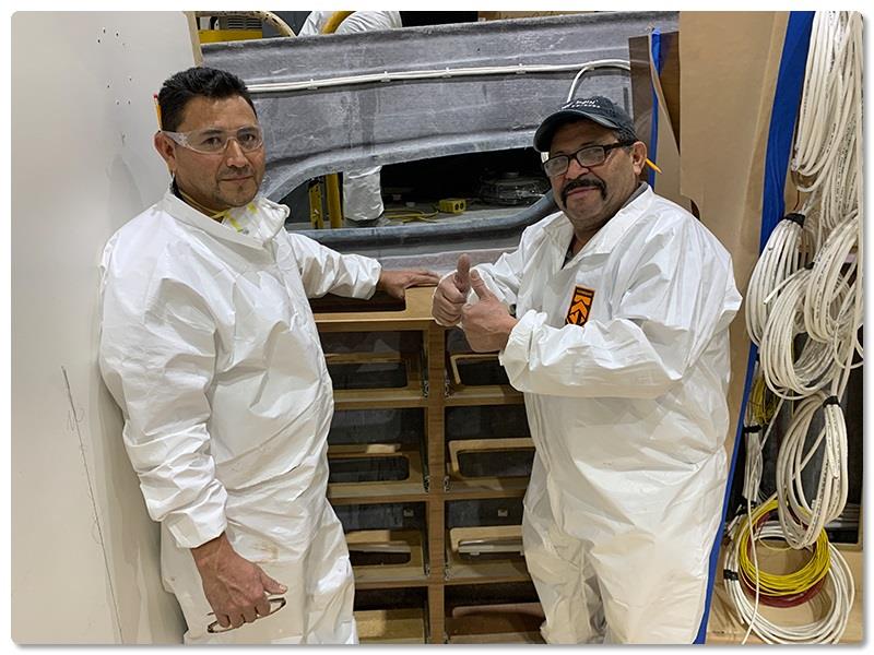 Rough Carpentry Leadman Rosa Cruz (giving two thumbs up) - photo © Viking Yachts