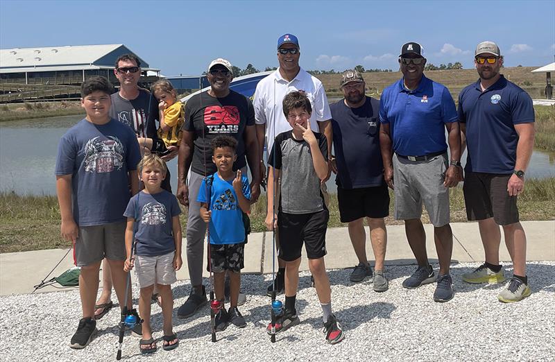 Volunteers from Ironworkers Local 397 and the NFL Players Association assisted youth with baiting, casting, reeling, and getting familiar with their new fishing rods and reels photo copyright Union Sportsmen's Alliance taken at  and featuring the Fishing boat class