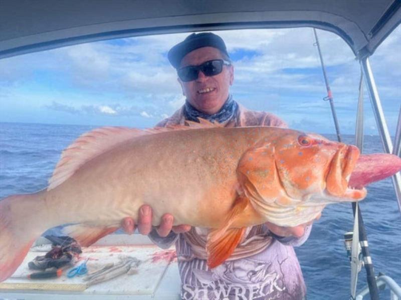 Rob with a horse of a bar cheek coral trout, well done mate