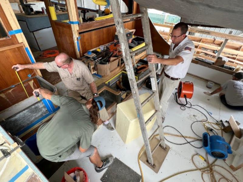 Hull #8 - Cockpit liner installation, Paul, Brian R, and Dusty - photo © Michael Rybovich & Sons