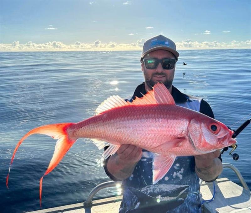Glassed out seas whilst pulling flamies from the depths. It's a tough life eh Clayton photo copyright Fisho's Tackle World taken at  and featuring the Fishing boat class