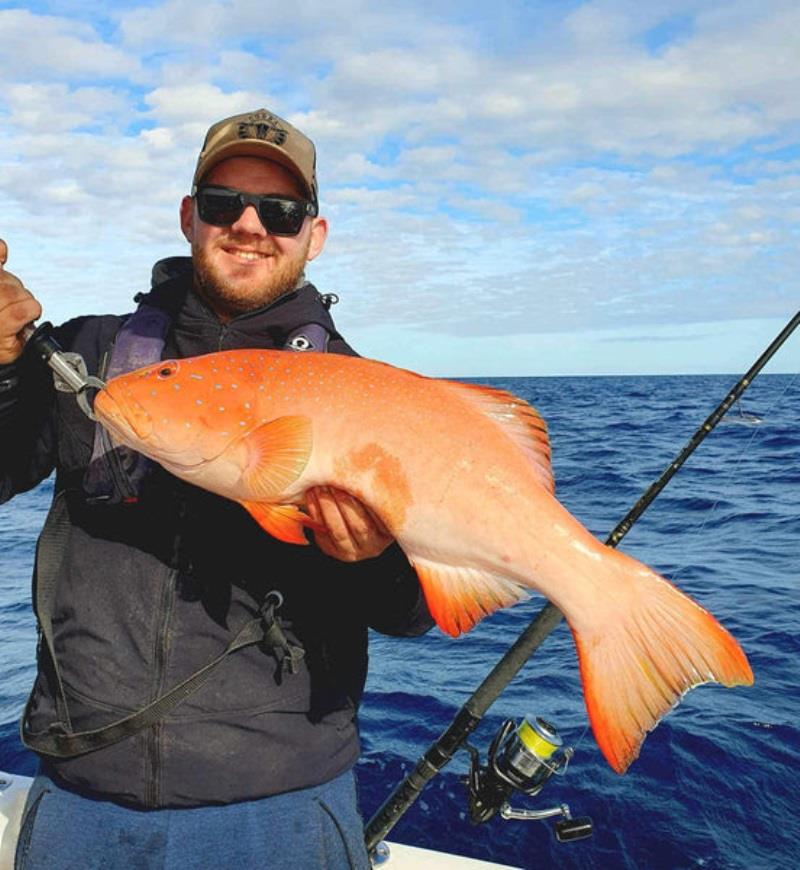 A happy Hot Reels charter client with a northern bay trout photo copyright Fisho's Tackle World taken at  and featuring the Fishing boat class