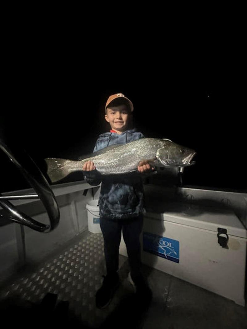 Young Keaton with a beaut jewfish caught after dark. Well done young fella photo copyright Fisho's Tackle World taken at  and featuring the Fishing boat class