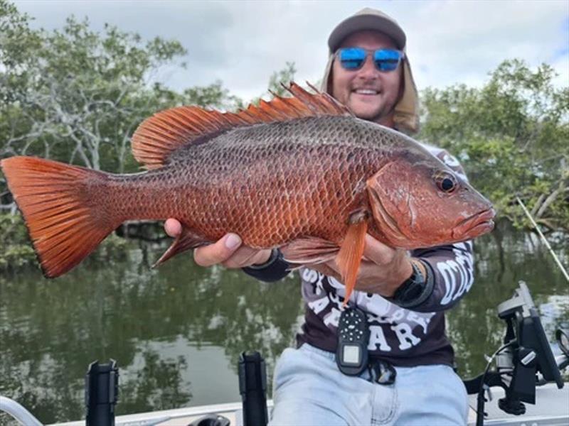 Jackson Ford with a red dog photo copyright Fisho's Tackle World taken at  and featuring the Fishing boat class