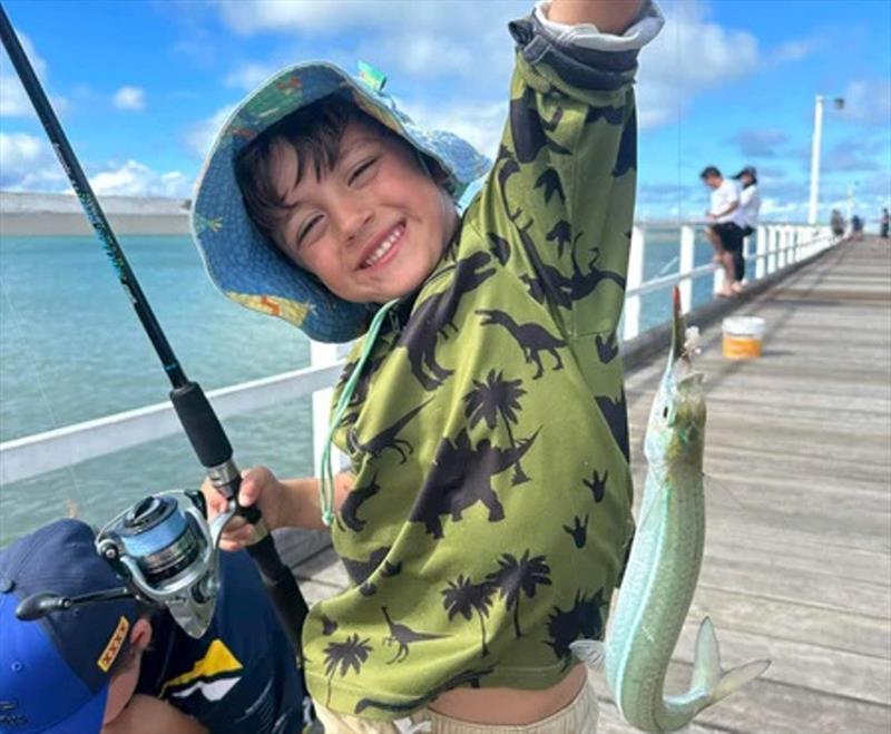Finny stoked with his gar-fish. A very visual species to target for the kids as you often see the fish eat the bait as the float goes under - photo © Fisho's Tackle World