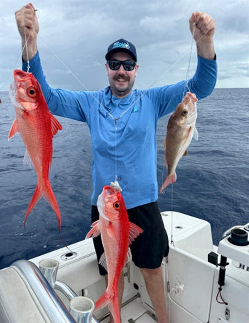Flamies and squire were thick in 200 metres or so last week. Here's staffer Scotty with a brace on the deep drop gear - photo © Fisho's Tackle World