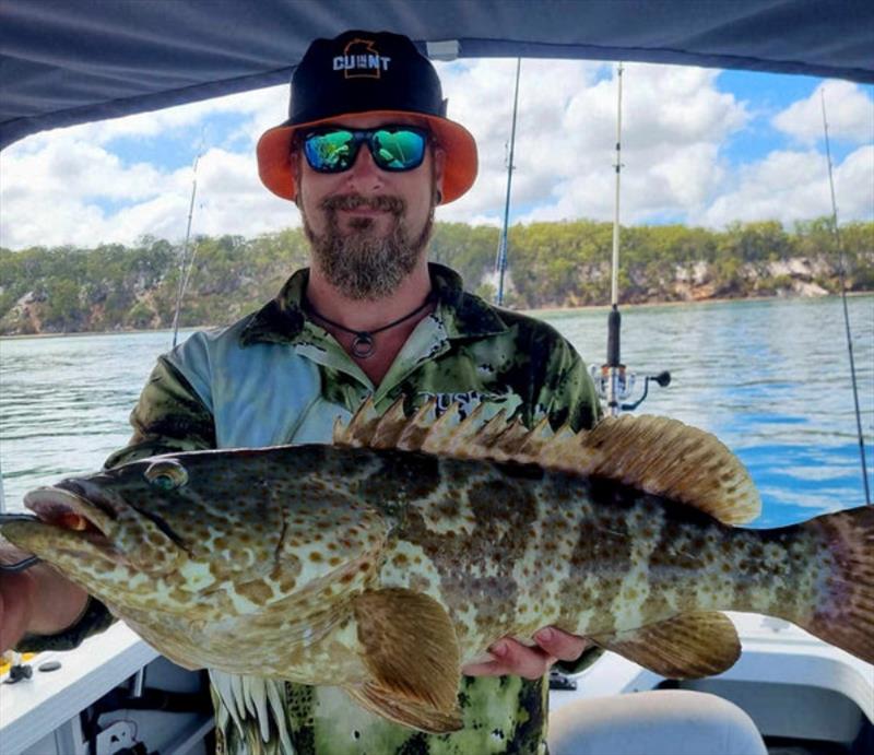 Pete with a typical estuary cod from inshore waters. They are hyperactive this time of year - photo © Fisho's Tackle World