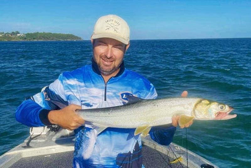 Deej with one of our premier sport fish, the ladyfish or giant herring. You need some sunnies mate. We sell all the best by the way photo copyright Fisho's Tackle World taken at  and featuring the Fishing boat class