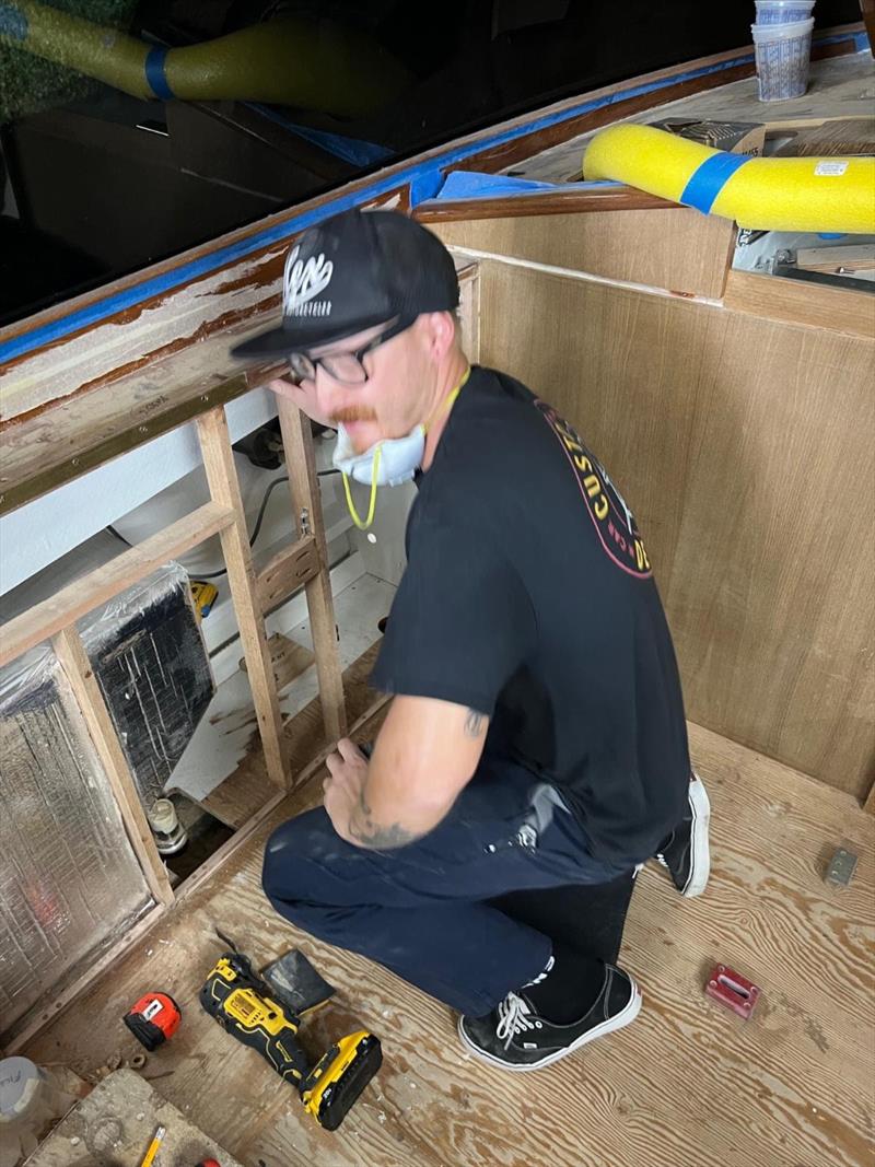 Hull #8 - Jason installing fuel tank vents - photo © Michael Rybovich & Sons