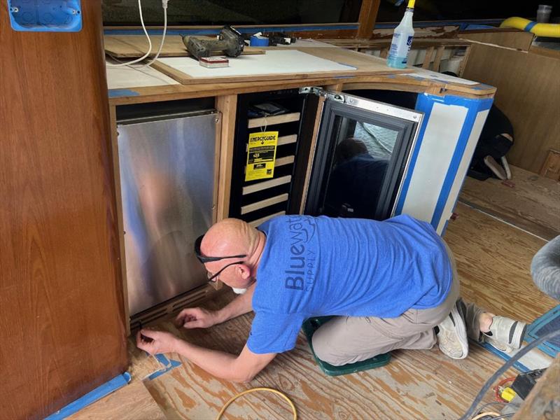Hull #8 - Mario fitting toekick vents - photo © Michael Rybovich & Sons