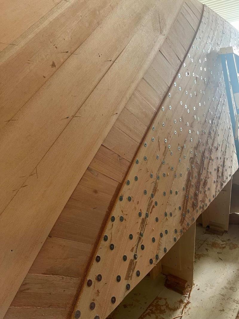 Hull #11 - Gluing second layer - photo © Michael Rybovich & Sons
