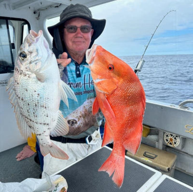 Fishing with Double Island Point Fishing Charters puts Bob onto the quality. Here he is with a Robinsons Sea Bream and a school red - photo © Fisho's Tackle World