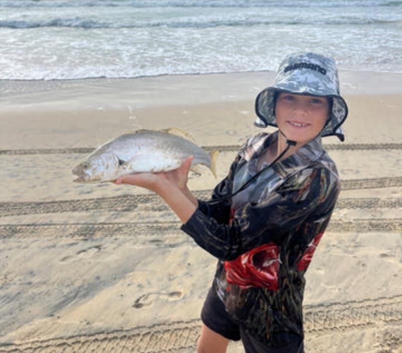 Lucas Ferguson was proud of this chunky little jewfish he caught and released from Fraser Island's surf on a beach worm - photo © Fisho's Tackle World
