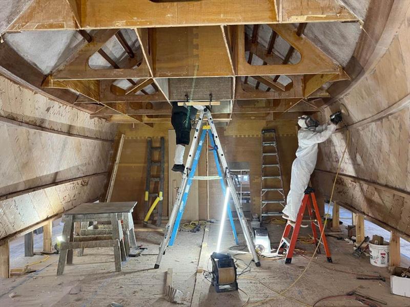 Hull #11 - Brian and Sal grinding inside planking - photo © Michael Rybovich & Sons