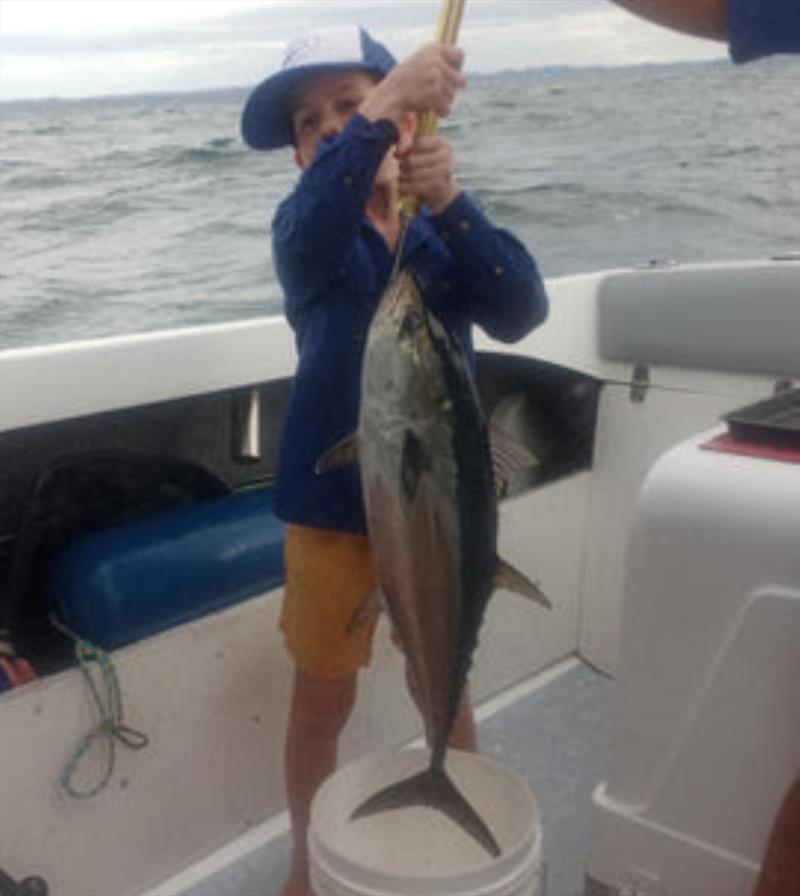 Kade has no trouble catching fish such as this fine longtail. Tuna are such a blast for the kids - photo © Fisho's Tackle World