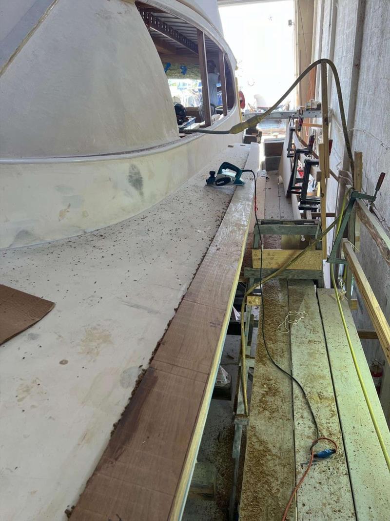 Hull #9 - Port toerail roughed in - photo © Michael Rybovich & Sons
