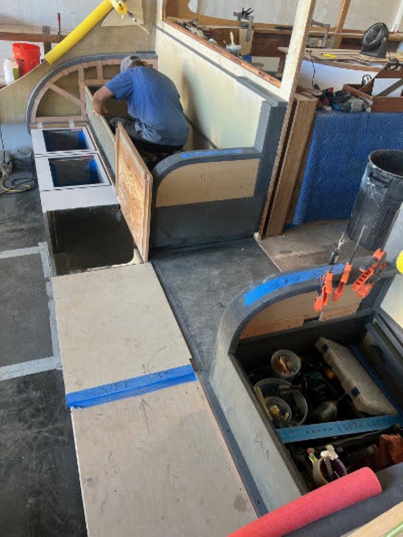 Hull #9 - Paul installing mezzanine freezer liner - photo © Michael Rybovich & Sons