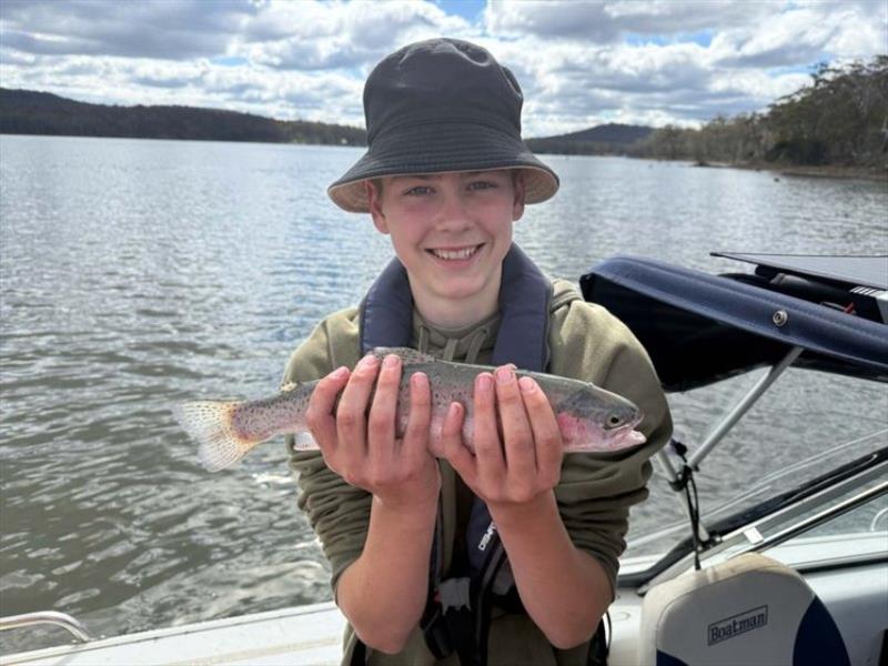 Esmond with a Tooms Lake Rainbow - photo © Spot On Fishing Hobart