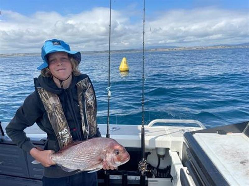 Jordy shows off the Snapper he caught off the Devonport FAD - photo © Department of NRE Tasmania