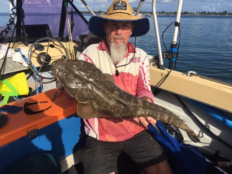 Tony with a sample of the big flathead lurking in the lower reaches of the Burrum - photo © Fisho's Tackle World Hervey Bay