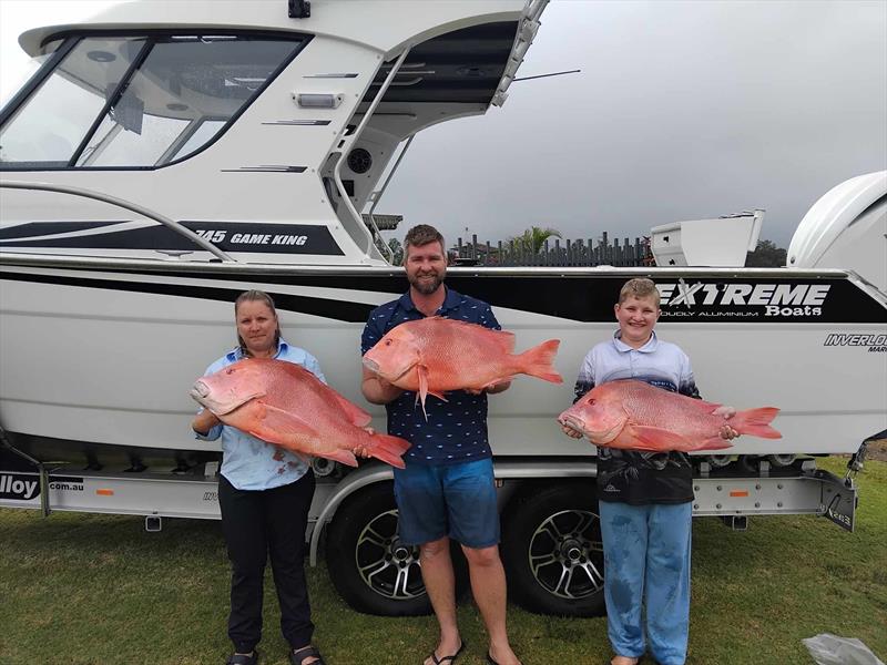 The Parker family with a brace of fine reds from their latest offshore mission - photo © Fisho's Tackle World Hervey Bay