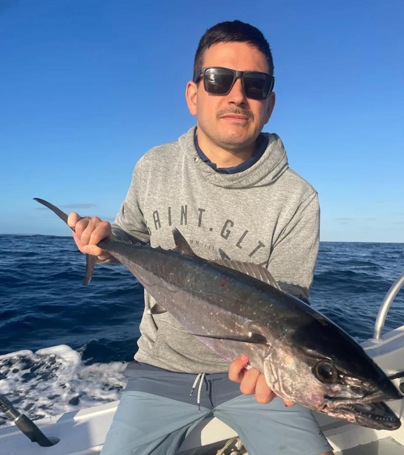 A cute little dogtooth tuna Mick's crew member picked up on the Sandy Cape Shoals. Proof once again that there are doggies out there photo copyright Fisho's Tackle World Hervey Bay taken at  and featuring the Fishing boat class