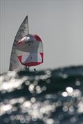 On the run. Campbell Alexander (obscured) and Chris Clark are pictured gliding behind a swell at a previous Flying 15 Nationals held offshore of Durban. Alexander will be one of the sailors vying for the title at the upcoming Flying 15 Nationals being hos © Sophie Thompson