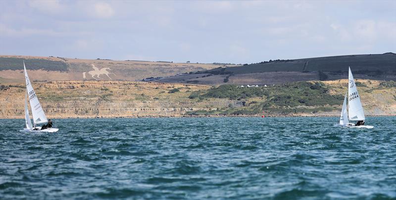 Race 9 - GBR 4144 keeping close tabs on GBR 4005 with the Osmington White Horse on the hillside on day 5 of the 2025 Flying Fifteen Worlds at the WPNSA - photo © Mark Jardine