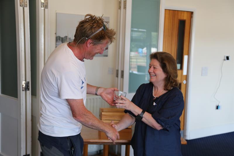 James Walters (Cidron Too) getting the Folkboat prize at the Central Solent Championship 2022 photo copyright Phil Horton taken at Hamble River Sailing Club and featuring the Folkboat class