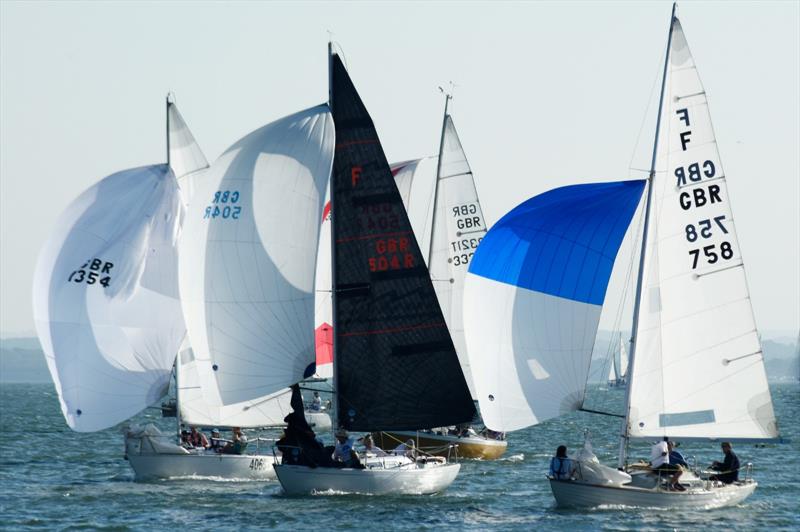 Tattarat (right) wins the Gold Roman Bowl - Round the Island Race 2026 photo copyright John Green taken at Lymington Town Sailing Club and featuring the Folkboat class