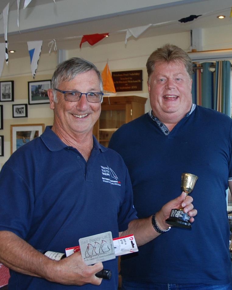 MYA Footy National Championship at Frensham Pond - John Burgoine being presented with trophy and prize by commodore, Jeremy Hudson photo copyright Roger Stollery taken at Frensham Pond Sailing Club and featuring the Footy class