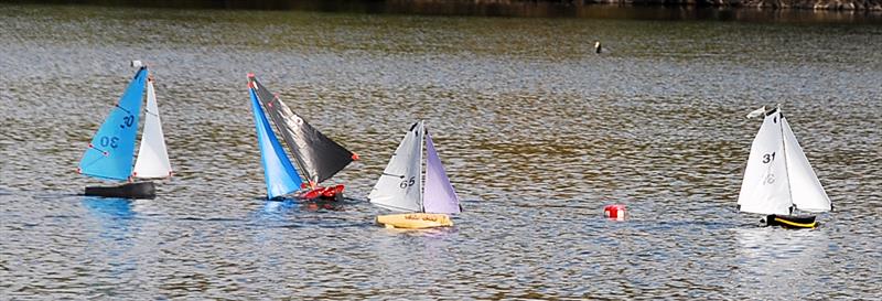 A gust has upset 35 which has rounded the windward mark with the others approaching it - Fred's Big Toephy (Footy class at Chertsey) photo copyright Peter Dunne taken at Guildford Model Yacht Club and featuring the Footy class