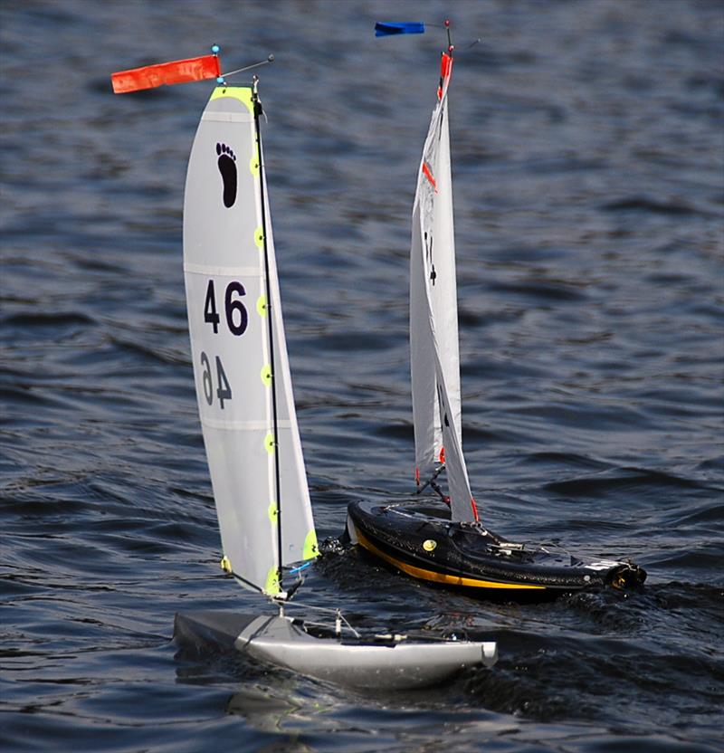 David Wilkinson 46 with his 3D printed hull running with Graham Whitehead 24 - Videlo Globe (Footy class at Frensham) photo copyright Roger Stollery taken at Frensham Pond Sailing Club and featuring the Footy class