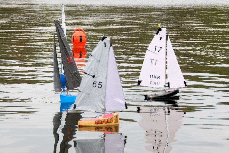 Vlad 17 gets the best start - Footy class Videlo Globe at Frensham Pond photo copyright Roger Stollery taken at Frensham Pond Sailing Club and featuring the Footy class