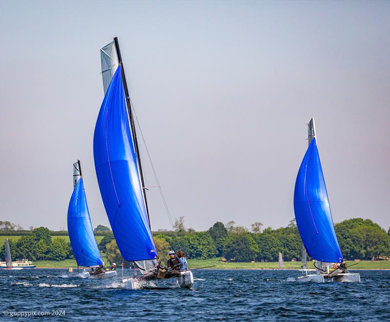 Nick Barnes' F18 races Will Smith and the Nacra 15 for the finish during the Rutland Cat Open 2024 - photo © Gordon Upton / www.guppypix.com